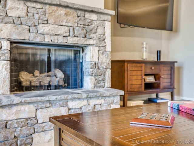 interior space featuring a stone fireplace