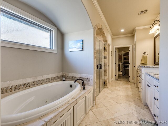 bathroom featuring vanity, ornamental molding, and shower with separate bathtub