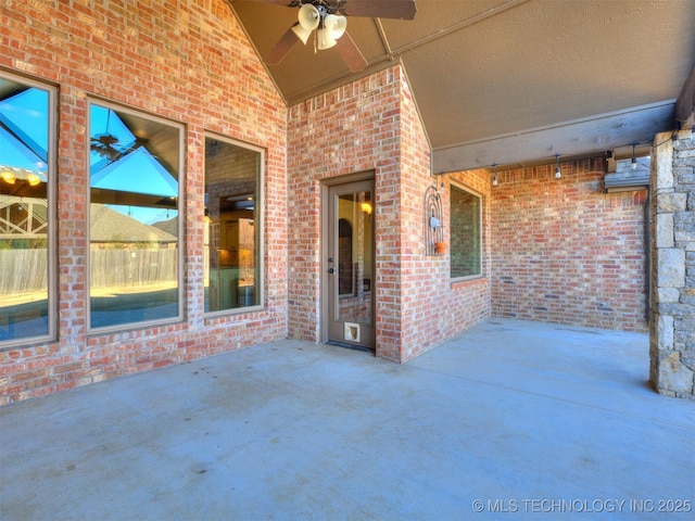 view of patio featuring ceiling fan