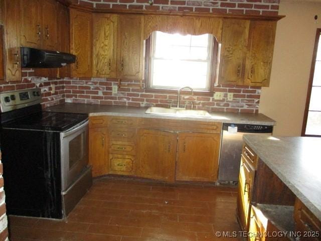 kitchen with dishwasher, backsplash, exhaust hood, sink, and electric range