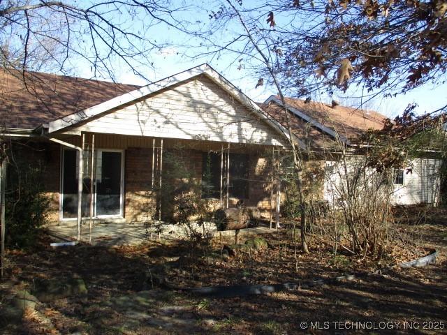 view of side of home with a sunroom