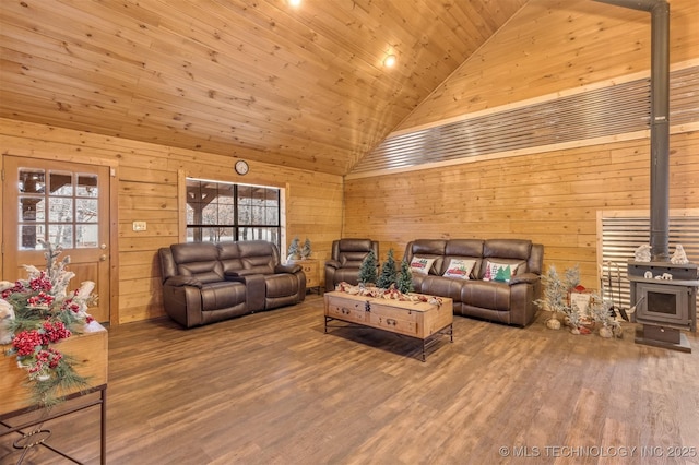 living room featuring a wood stove, a healthy amount of sunlight, high vaulted ceiling, hardwood / wood-style floors, and wood ceiling