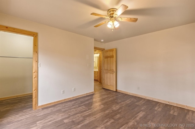 empty room featuring ceiling fan and hardwood / wood-style flooring