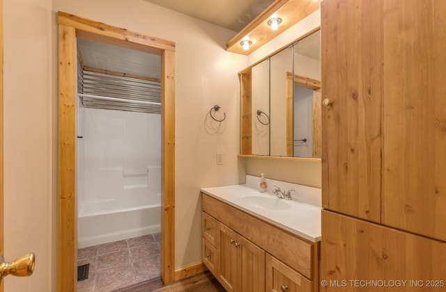 bathroom featuring vanity and bathtub / shower combination