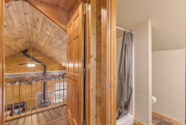 bathroom with ceiling fan, wooden ceiling, vaulted ceiling, and hardwood / wood-style flooring