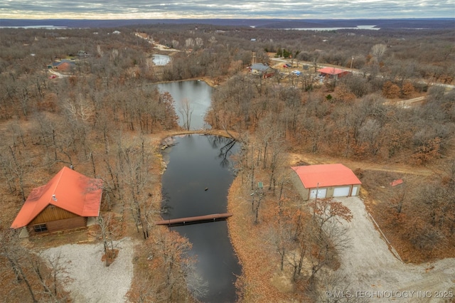 aerial view at dusk with a water view