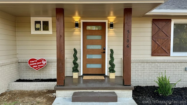 entrance to property with a porch