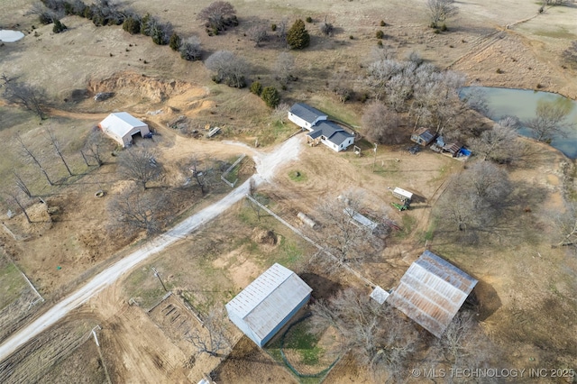 drone / aerial view with a rural view and a water view