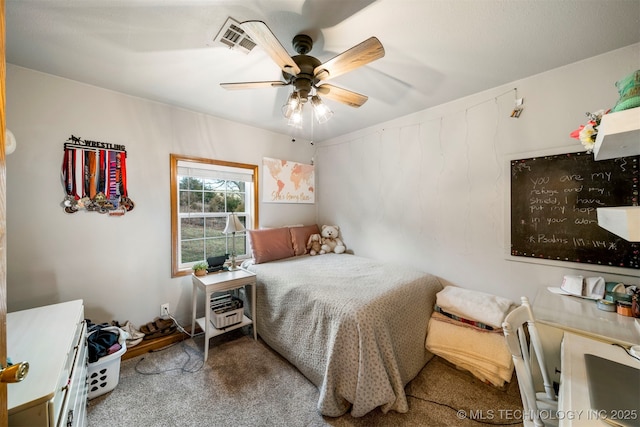 carpeted bedroom with ceiling fan