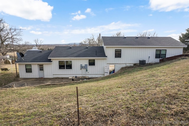 back of property with a patio, cooling unit, and a lawn