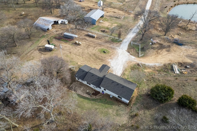 birds eye view of property featuring a rural view and a water view