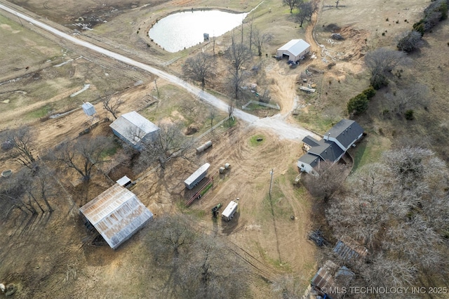 birds eye view of property featuring a rural view