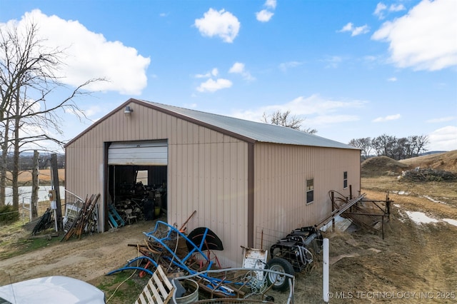 view of outbuilding featuring a garage