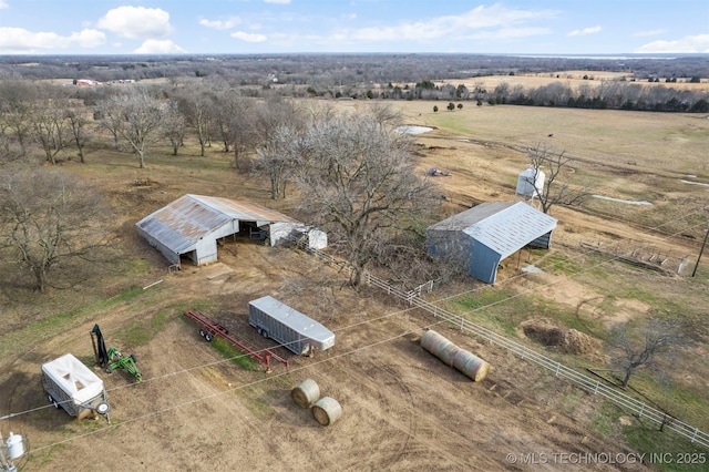 birds eye view of property featuring a rural view