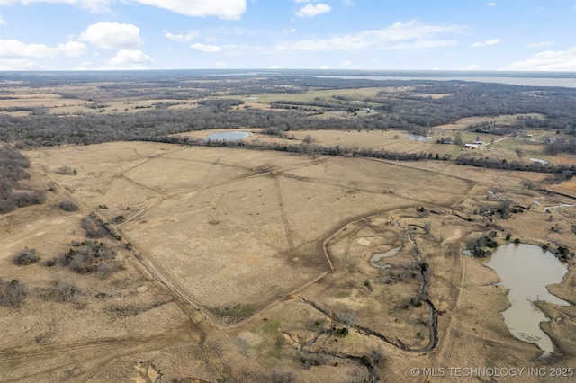 aerial view featuring a rural view and a water view