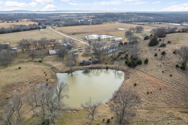 aerial view with a rural view and a water view