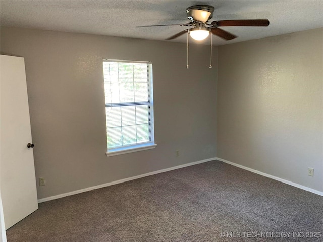 spare room featuring carpet, a textured ceiling, and ceiling fan