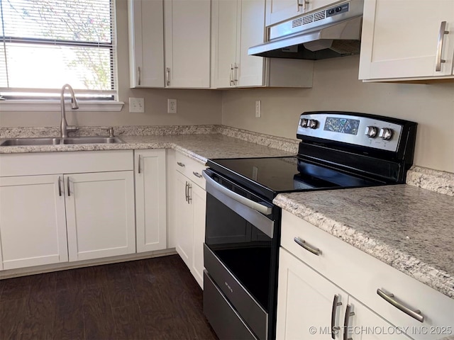 kitchen featuring stainless steel electric stove, dark hardwood / wood-style floors, white cabinets, and sink