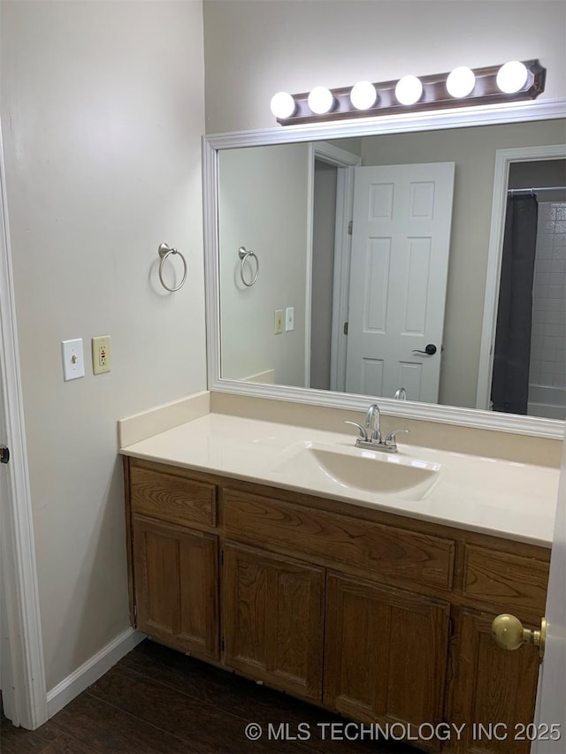 bathroom with vanity and wood-type flooring