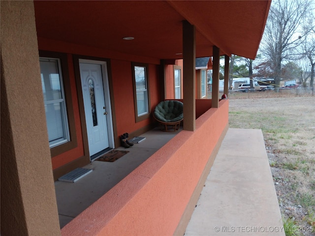 entrance to property featuring stucco siding