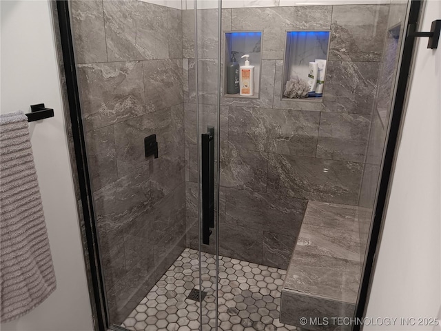 bathroom with a shower stall