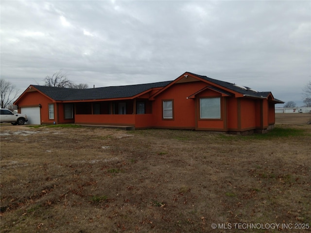 exterior space with a garage and a front yard