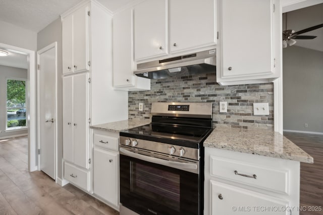 kitchen featuring ceiling fan, white cabinetry, light stone counters, tasteful backsplash, and stainless steel range with electric cooktop