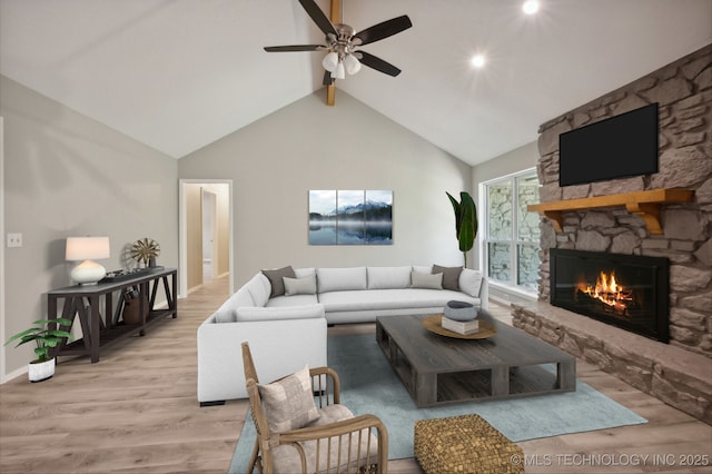 living room with a stone fireplace, high vaulted ceiling, beamed ceiling, ceiling fan, and light hardwood / wood-style floors