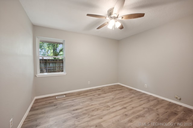 unfurnished room featuring ceiling fan and light hardwood / wood-style floors