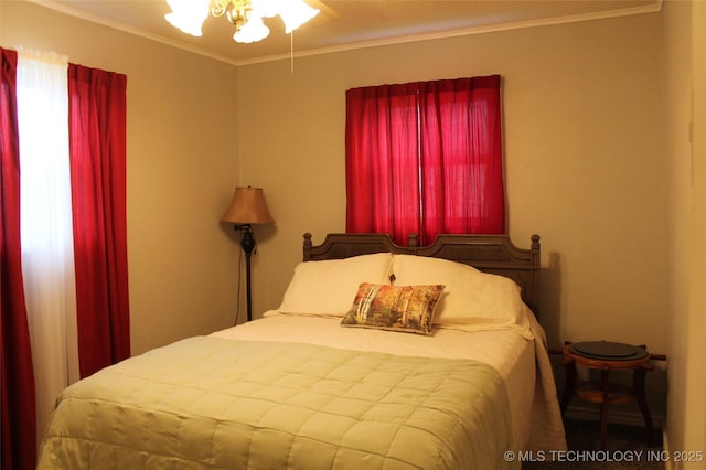 bedroom with ornamental molding