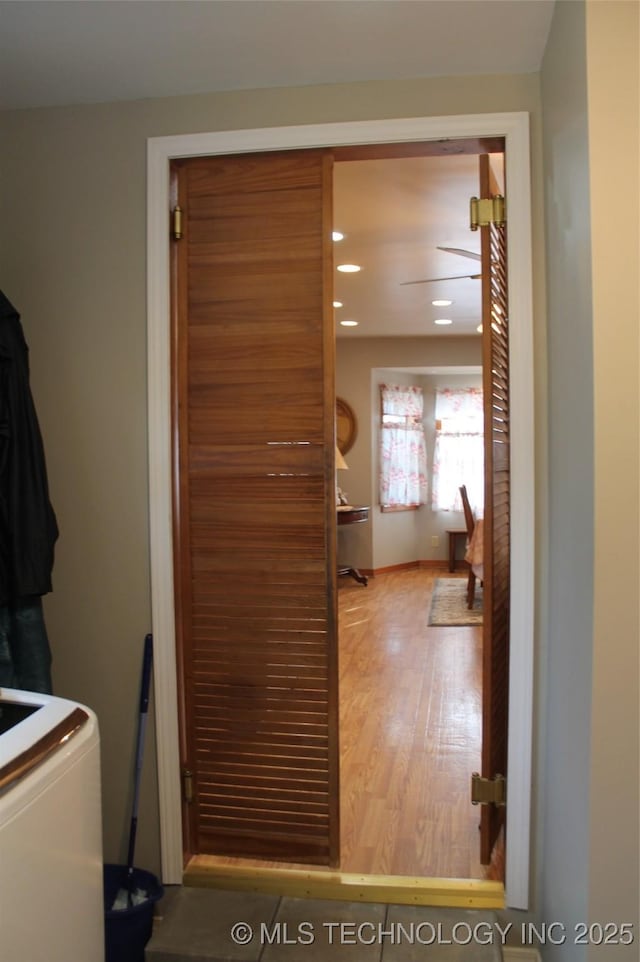 laundry room with washer / clothes dryer and hardwood / wood-style flooring