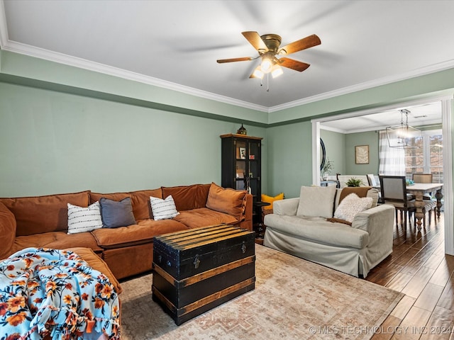 living room featuring ceiling fan, ornamental molding, and hardwood / wood-style flooring