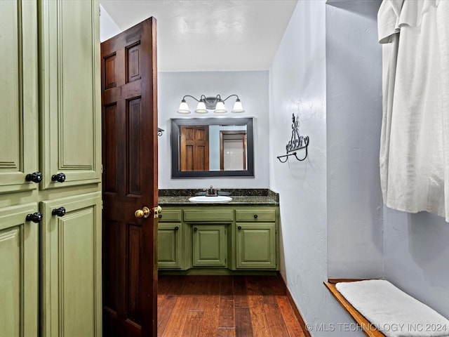 bathroom with vanity and hardwood / wood-style flooring