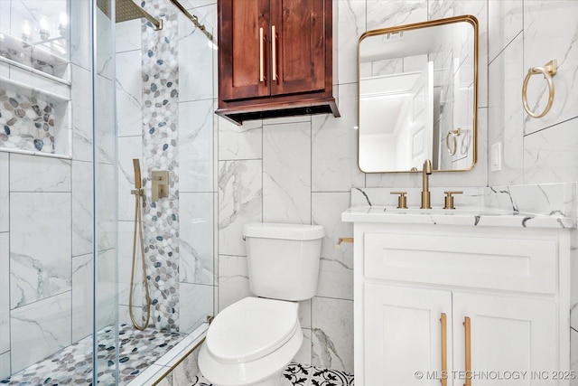 bathroom with vanity, toilet, and a shower with shower door