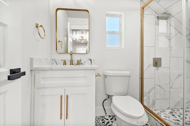 bathroom with tile patterned floors, toilet, vanity, and walk in shower