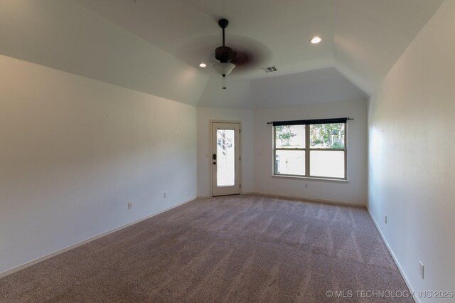 unfurnished room with ceiling fan, vaulted ceiling, and carpet