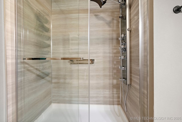 full bath featuring a stall shower