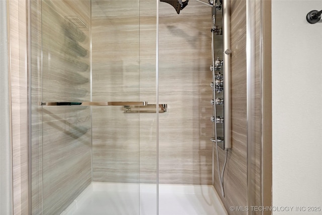 bathroom featuring an enclosed shower