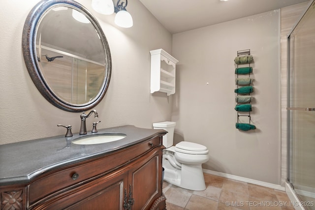 bathroom featuring baseboards, an enclosed shower, vanity, and toilet