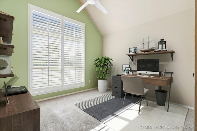 carpeted office space featuring plenty of natural light, ceiling fan, and vaulted ceiling