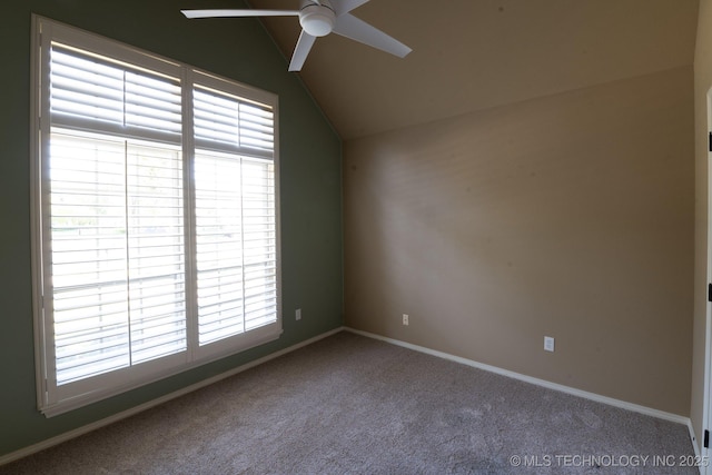 carpeted spare room with ceiling fan and lofted ceiling