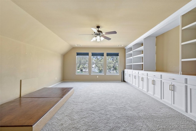 bonus room with ceiling fan, light colored carpet, and lofted ceiling