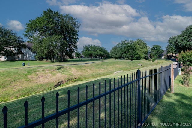 surrounding community featuring a lawn and fence