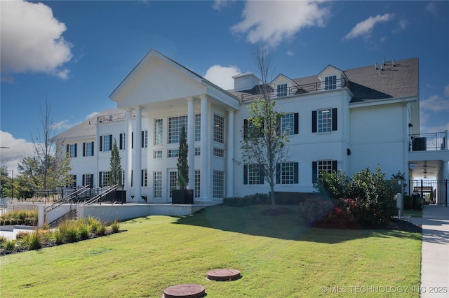 greek revival house with a front lawn