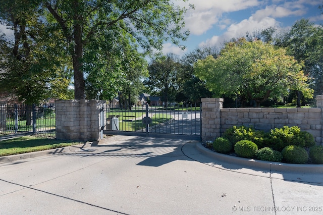 view of gate with fence