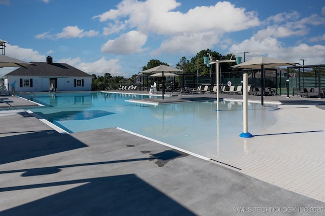 view of swimming pool with a patio area