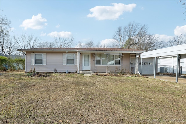 single story home with a carport and a front yard