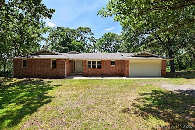 single story home featuring a garage and a front lawn