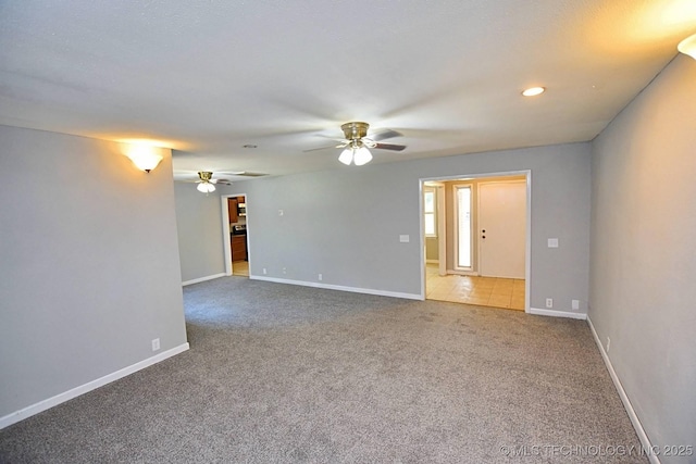 unfurnished room featuring carpet and ceiling fan