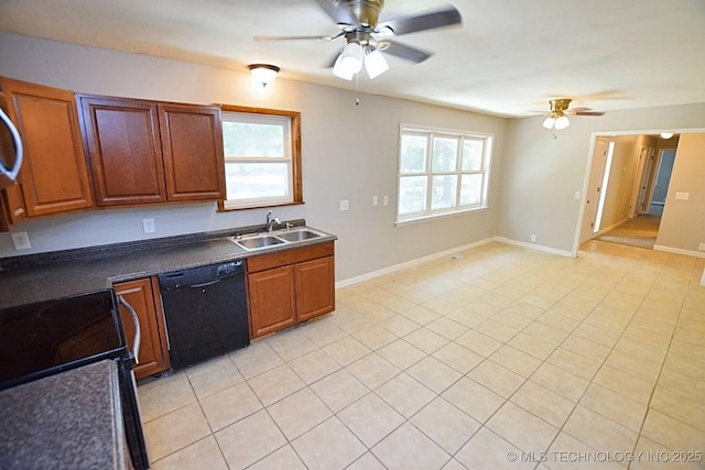 kitchen with dishwasher, light tile patterned flooring, stove, and sink